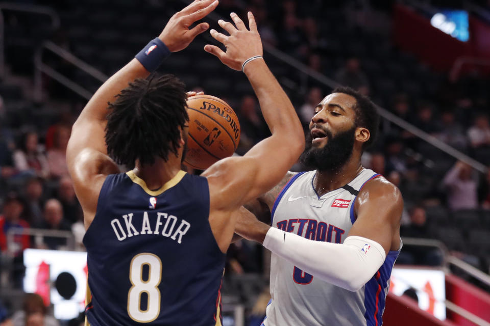 Detroit Pistons center Andre Drummond (0) attempt a shot as New Orleans Pelicans center Jahlil Okafor (8) defends during the first half of an NBA basketball game, Monday, Jan. 13, 2020, in Detroit. (AP Photo/Carlos Osorio)