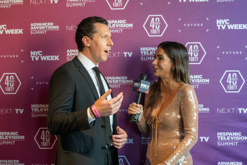 Ryan Kristafer, a 40 Under 40 honoree and entertainment anchor/reporter at WNYW New York, is interviewed by event host and Fox 5 colleague Bianca Peters.