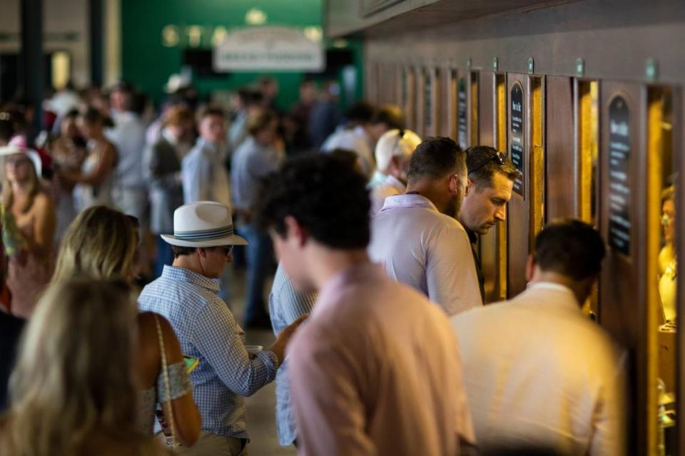 Patrons place bets before races during the Spring Meet at Keeneland on April 15. “I don’t think it’s going to pull money from our handle,” Jim Goodman, director of wagering development at Keeneland, said of legalized sports betting in Kentucky. “I do think it will expose horse racing to a different generation.” Silas Walker/swalker@herald-leader.com