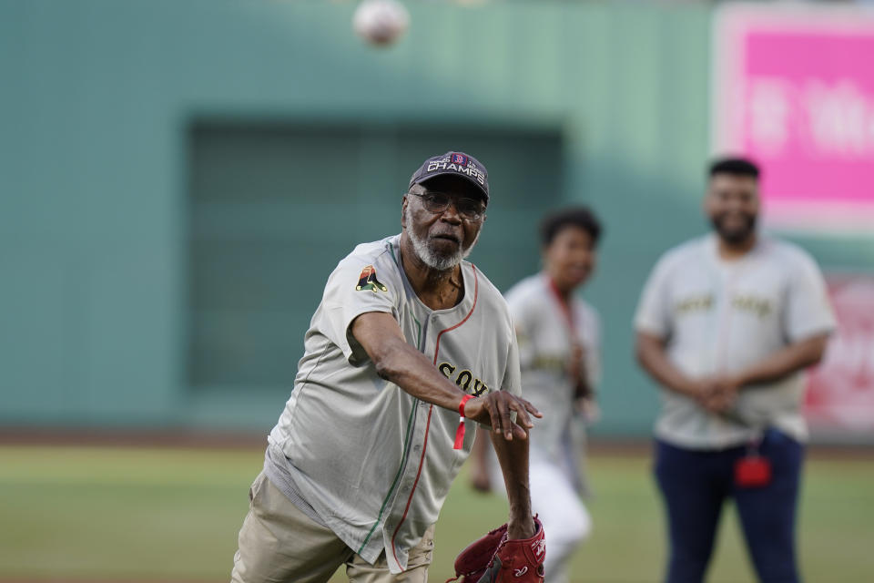 Juneteenth flag designer Ben Haith delivers a ceremonial first pitch from the mound at Fenway Park before a New York Yankees baseball game against the Boston Red Sox, Sunday, June 18, 2023, in Boston. The Red Sox were among the teams marking the June 19 holiday this weekend. (AP Photo/Steven Senne)