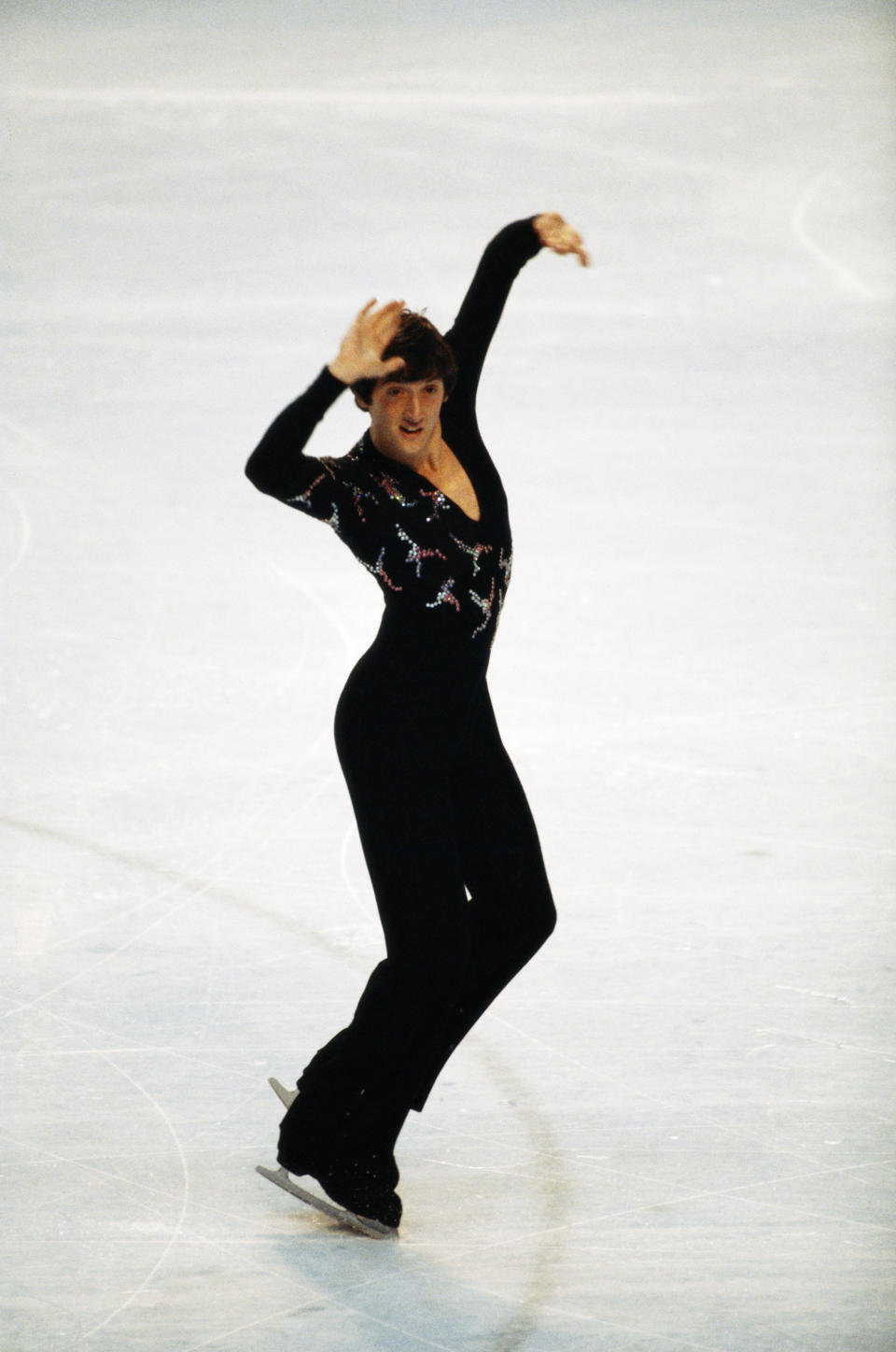 The British skater performs part of his gold medal routine during the free program of the men's figure skating event on&nbsp;Feb. 21, 1980, during the Winter Games in Lake Placid, New York.