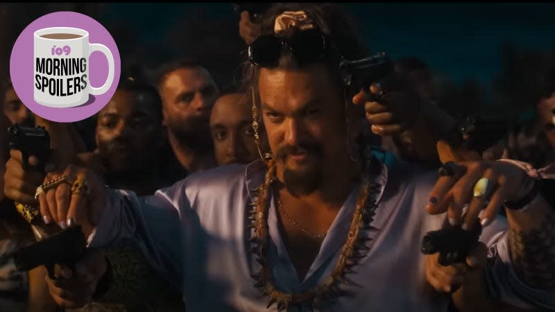 A grinning Jason Momoa sits on a throne with gunmen positioned behind him.