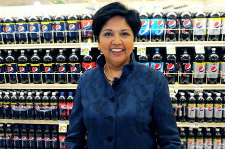 PepsiCo CEO Indra Nooyi poses for a portrait by products at the Tops SuperMarket in Batavia, New York, U.S. on June 3, 2013. REUTERS/Don Heupel/File Photo