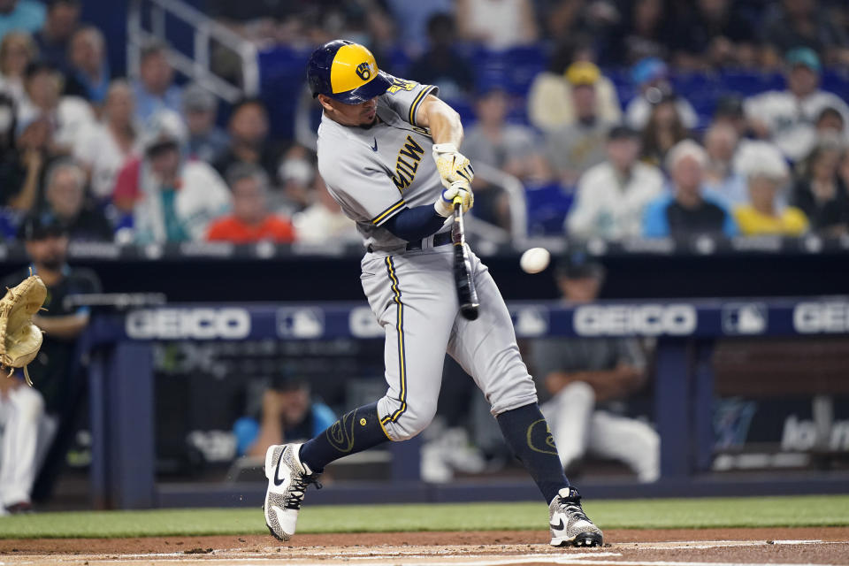 Milwaukee Brewers' Willy Adames hits a solo home run during the first inning of the team's baseball game against the Miami Marlins, Saturday, May 14, 2022, in Miami. (AP Photo/Lynne Sladky)