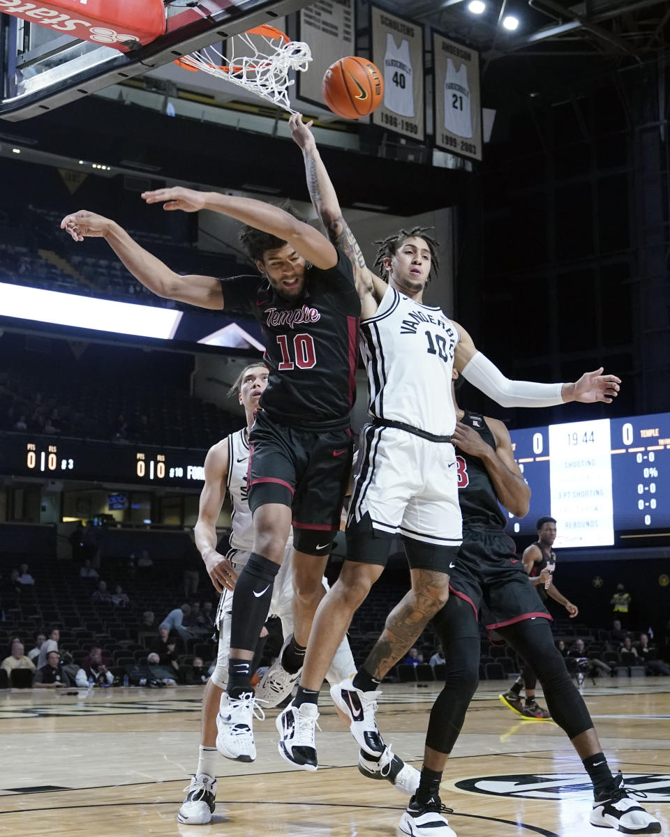 Temple's Jake Forrester, left, battles Vanderbilt's Myles Stute, right, under the basket in the first half of an NCAA college basketball game Tuesday, Dec. 7, 2021, in Nashville, Tenn. (AP Photo/Mark Humphrey)