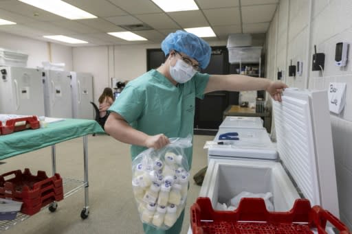 A lab tech prepares three-ounce servings of breast milk to be shipped to nearby hospitals at the Mountain West Mothers' Milk Bank in December 2019