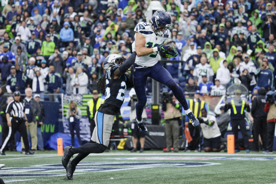 Seattle Seahawks wide receiver Jake Bobo catches a touchdown pass over Carolina Panthers cornerback Donte Jackson during the second half of an NFL football game Sunday, Sept. 24, 2023, in Seattle. (AP Photo/John Froschauer)