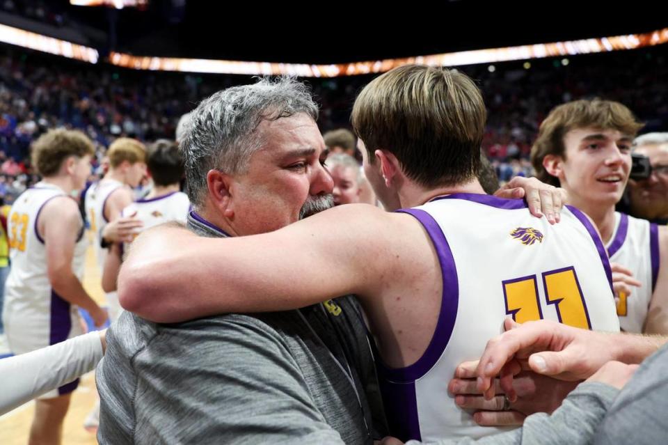 Lyon County head coach Ryan Perry hugged his son Travis Perry after the Lyons won the state championship in Rupp Arena last month.