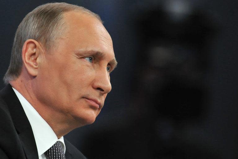 Russian President Vladimir Putin says "only a sick person" would think Russia would attack NATO