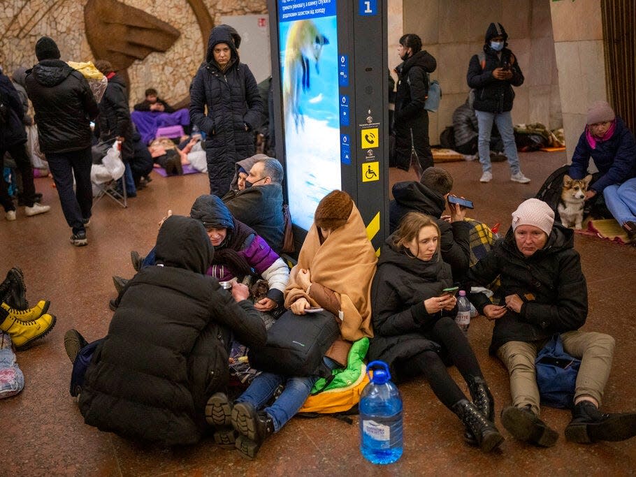 People rest in the Kyiv subway, using it as a bomb shelter in Kyiv, Ukraine, Thursday, Feb. 24, 2022.