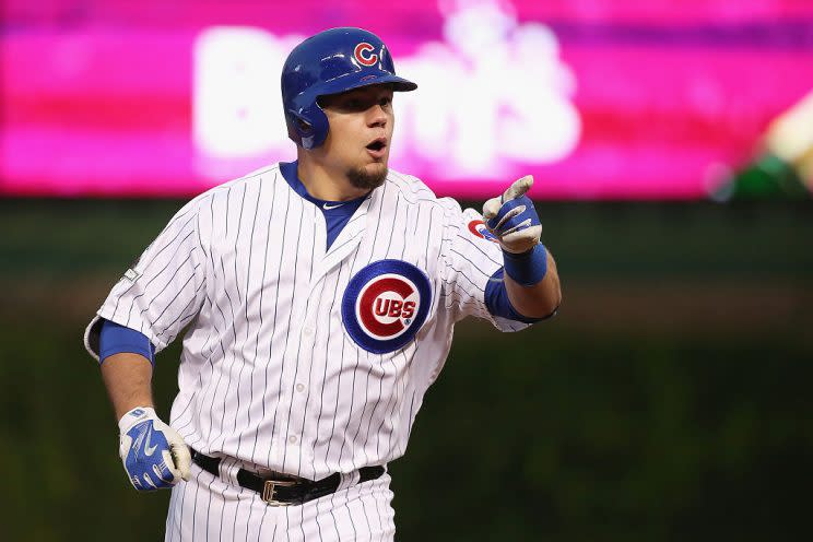 CHICAGO, IL - OCTOBER 13: Kyle Schwarber #12 of the Chicago Cubs points to the dugout after hitting a solo home run in the seventh inning against the St. Louis Cardinals during game four of the National League Division Series at Wrigley Field on October 13, 2015 in Chicago, Illinois. (Photo by Jonathan Daniel/Getty Images)