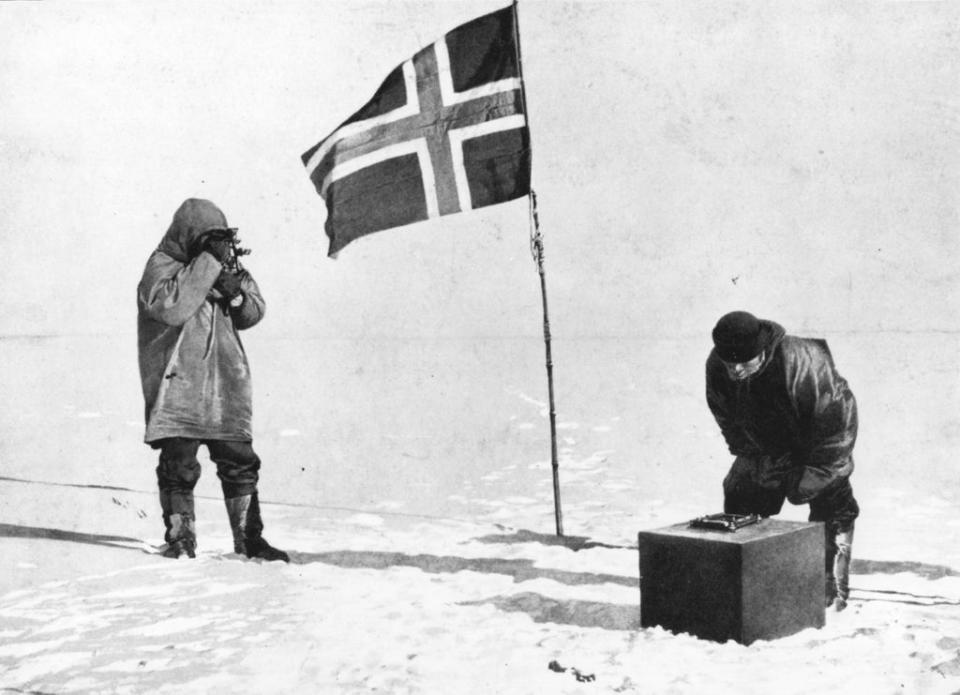 Amundsen taking sights at the South Pole beside the Norwegian flag (Getty)