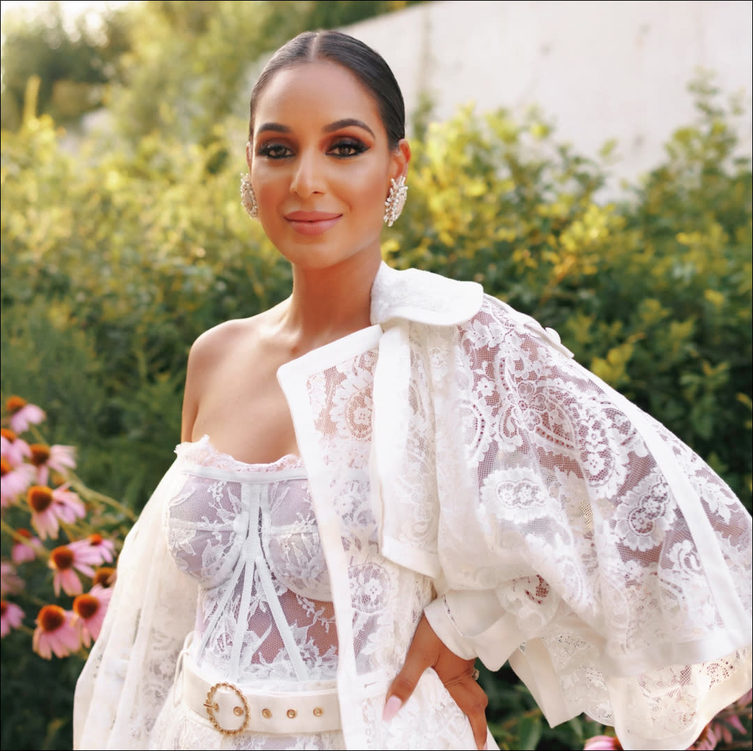  Jessel Taank poses in a white lace jumpsuit 