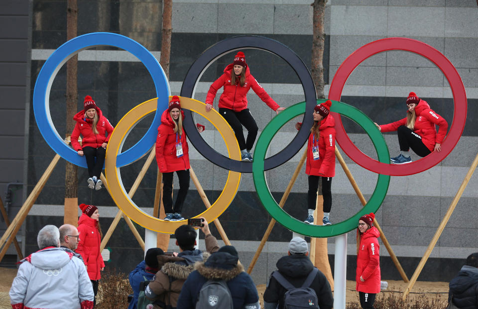 Swiss athletes pose&nbsp;inside the Olympic rings in Pyeongchang, South Korea, on Feb. 8, 2018. (Photo: Steve Russell via Getty Images)