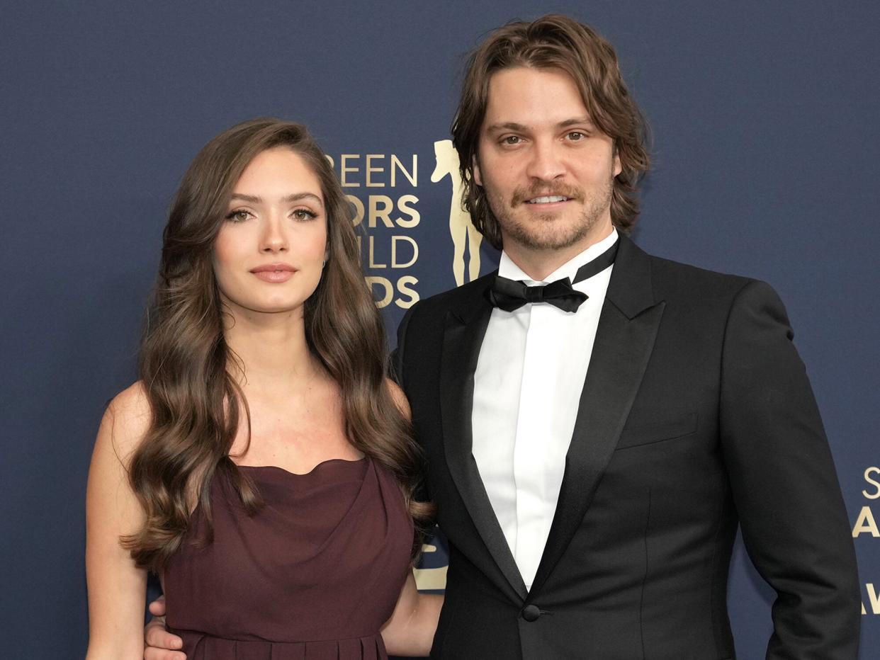 Bianca Rodrigues and Luke Grimes attend the 28th Annual Screen Actors Guild Awards at Barker Hangar on February 27, 2022 in Santa Monica, California