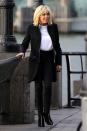 <p>In a sleek black coat, white tee, black skinny jeans, and front zip black ankle boots while visiting New York City.</p>