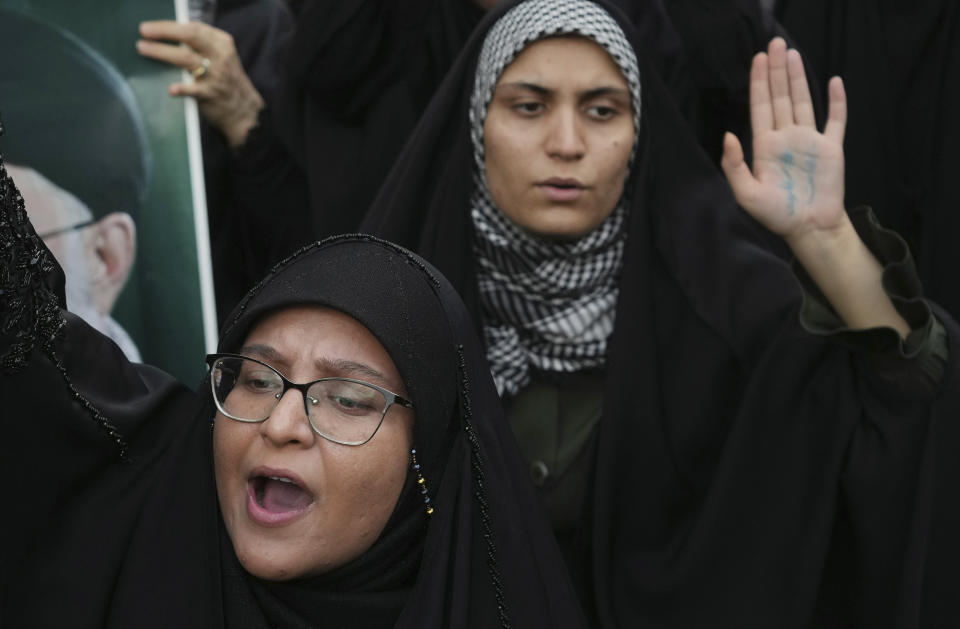 Protesters chant slogans against Sweden in front of the embassy in Tehran, Iran, Friday, July 21, 2023. Thousands of people took to the streets in a handful of Muslim-majority countries Friday to express their outrage at the desecration of a copy of the Quran in Sweden, a day after protesters stormed the country's embassy in Iraq. (AP Photo/Vahid Salemi)
