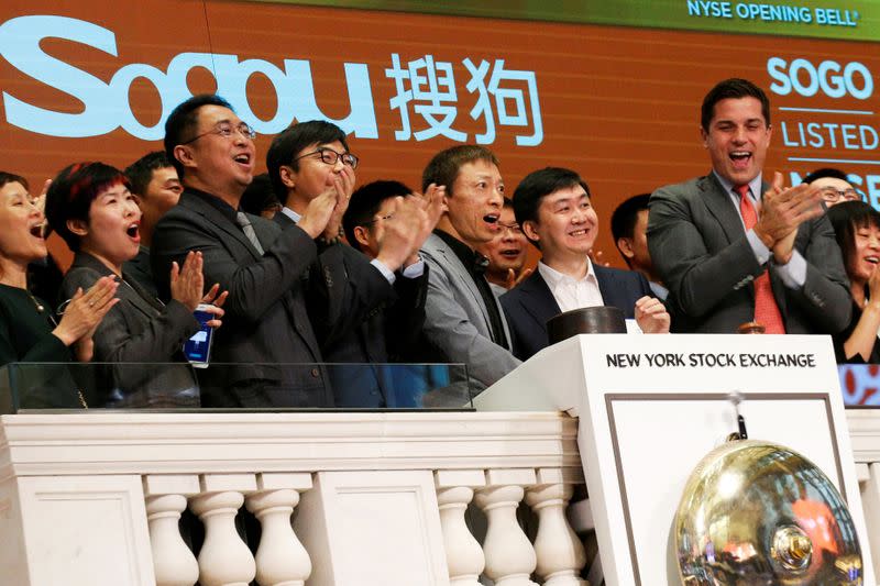 FILE PHOTO: Sogou officials ring the opening bell to celebrate their company's New York market debut in 2017