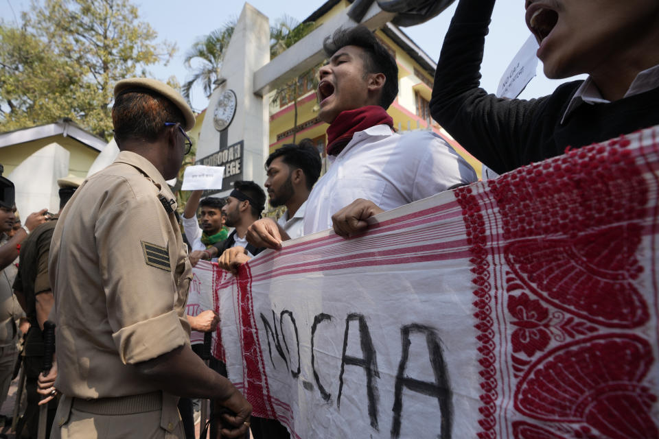 Police stop students trying take out a protest against the Citizenship Amendment Act (CAA) in Guwahati, India, Tuesday, March 12, 2024. India has implemented a controversial citizenship law that has been widely criticized for excluding Muslims, a minority community whose concerns have heightened under Prime Minister Narendra Modi’s Hindu nationalist government. The act provides a fast track to naturalization for Hindus, Parsis, Sikhs, Buddhists, Jains and Christians who fled to Hindu-majority India from Afghanistan, Bangladesh and Pakistan before Dec. 31, 2014. (AP Photo/Anupam Nath)