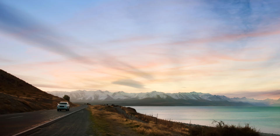 Banner of traveling on the road with mountain range near lake  in New zealand