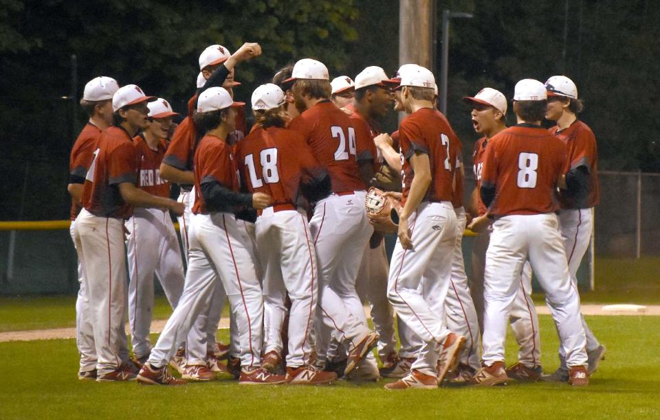 Vernon-Verona-Sherrill players gather between the mound and home plate at Veterans Memorial Park after recording the final out against Little Falls in a Section III playoff game.