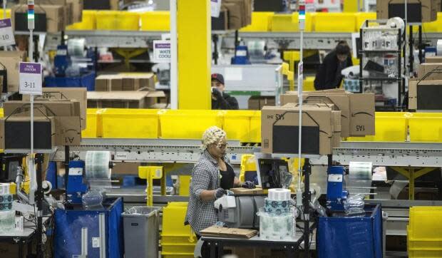 Peel Public Health has partially closed two Amazon fulfilment centres in Brampton, Ont., and Bolton, Ont., to control the spread of COVID-19 outbreaks in those workplaces. (Chris Young/The Canadian Press - image credit)