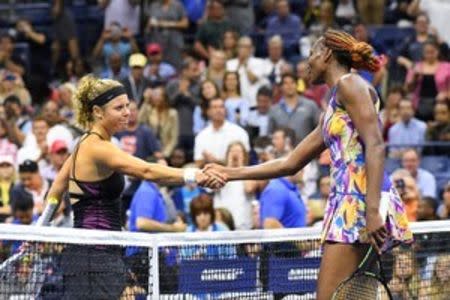 Venus Williams of the USA and Laura Siegemund of Germany shake hands after their match on day six of the 2016 U.S. Open tennis tournament at USTA Billie Jean King National Tennis Center. Mandatory Credit: Robert Deutsch-USA TODAY Sports