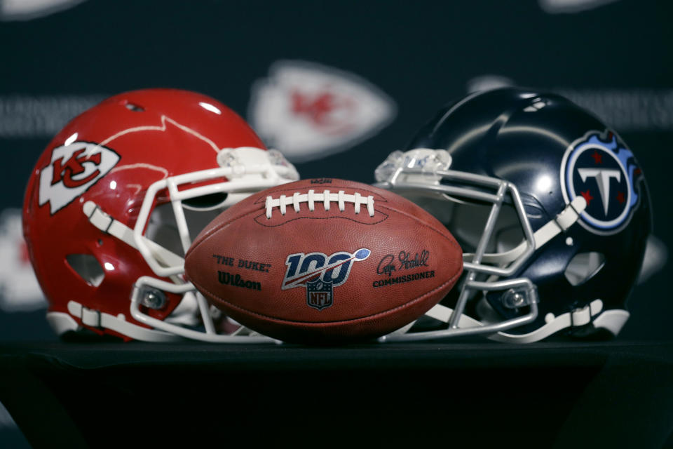 Helmets for the Kansas City Chiefs and the Tennessee Titans are displayed during a news conference for this weeks NFL conference championship football game at Arrowhead Stadium in Kansas City, Mo., Thursday, Jan. 16, 2020. (AP Photo/Charlie Riedel)