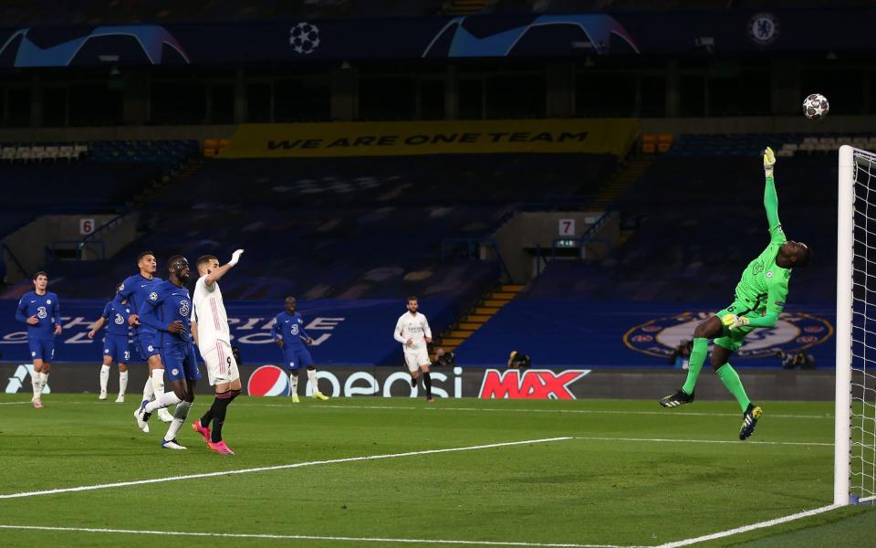 Edouard Mendy of Chelsea makes a save from Karim Benzema of Real Madrid during the UEFA Champions League Semi Final Second Leg match between Chelsea and Real Madrid at Stamford Bridge on May 05, 2021 in London, England. Sporting stadiums around Europe remain under strict restrictions due to the Coronavirus Pandemic as Government social distancing laws prohibit fans inside venues resulting in games being played behind closed doors - Steve Bardens - UEFA/UEFA via Getty Image