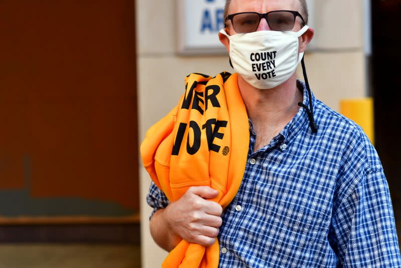 Activists wears a "COUNT EVERY VOTE" face mask due to the coronavirus pandemic in Philadelphia