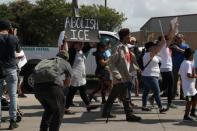 FILE PHOTO: People protesting the detainment of undocumented immigrant children participate in a demonstration outside a U.S. Border Patrol processing center in McAllen, Texas, U.S., June 25, 2018. REUTERS/Loren Elliott/File Photo