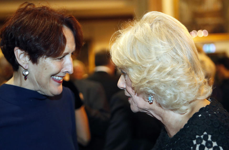 Britain's Camilla, the Duchess of Cornwall chats with actress Fiona Shaw before she presents the Man Booker Prize for Fiction 2018 during the prize's 50th year at the Guildhall in London, Tuesday, Oct. 16, 2018.(AP Photo/Frank Augstein, Pool)