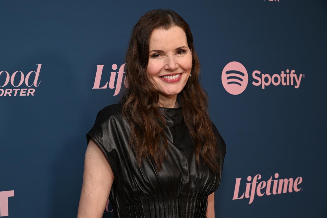 Geena Davis in a black dress