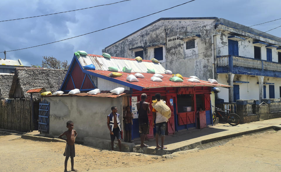 A street scene in Mananjary, Madagascar, Wednesday, March 8, 2023. Southeastern Madagascar has been battered by three intense cyclones in the space of a year and humanitarian groups say it is now facing a hunger emergency because of those climatic disasters. (AP Photo/Sarah Tetaud)