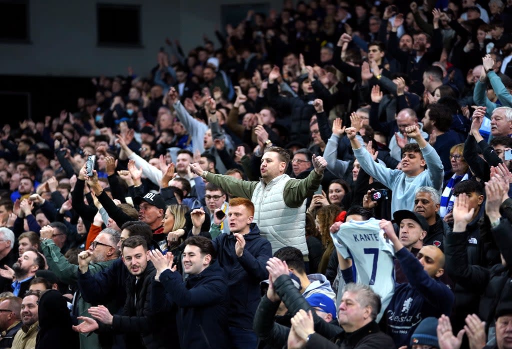 Chelsea fans celebrate the team’s victory at Norwich on Thursday night (Joe Giddens/PA) (PA Wire)