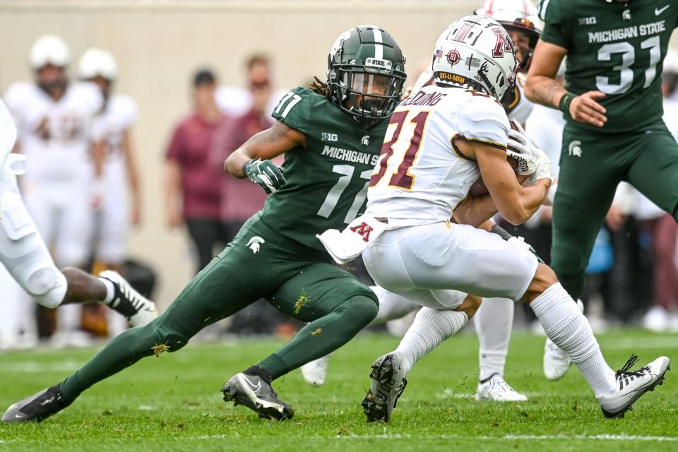 Michigan State's Quavian Carter, left, closes in on Minnesota's Quentin Redding during the first quarter on Saturday, Sept. 24, 2022, at Spartan Stadium in East Lansing.
