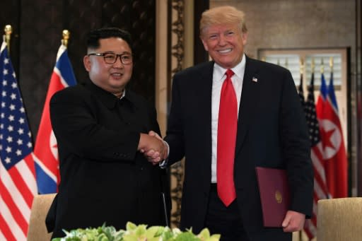 US President Donald Trump (R) and North Korea's leader Kim Jong Un in Singapore