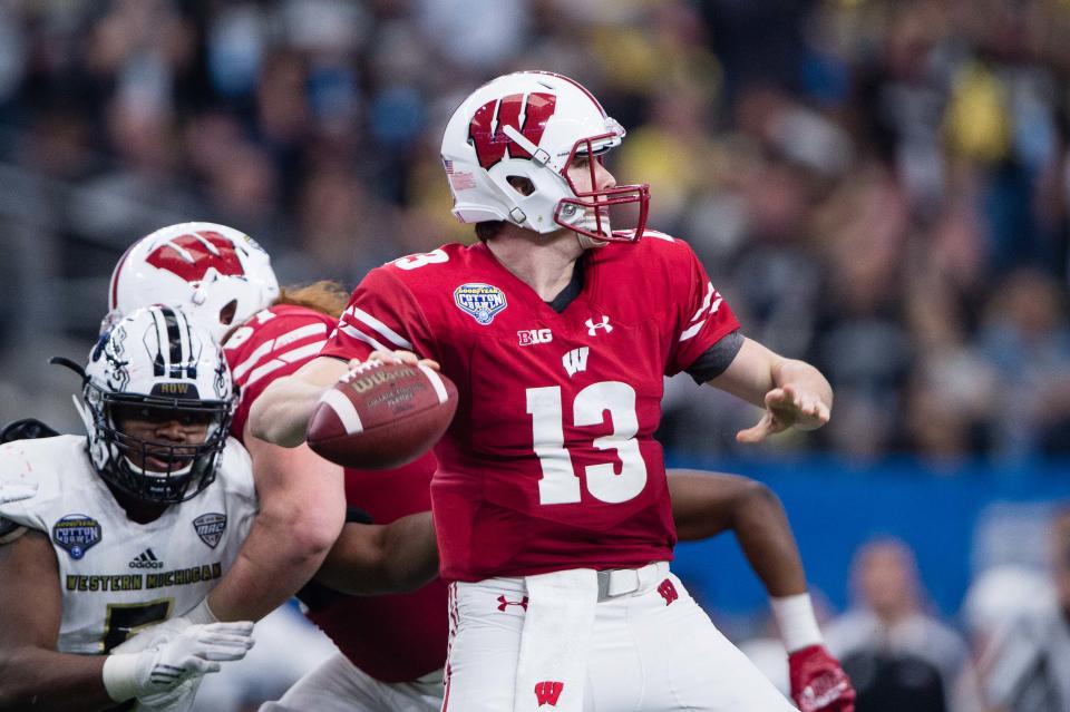 Jan 2, 2017; Arlington, TX, USA; Wisconsin Badgers quarterback Bart Houston (13) in action during the game against the <a class="link " href="https://sports.yahoo.com/ncaaf/teams/w-michigan/" data-i13n="sec:content-canvas;subsec:anchor_text;elm:context_link" data-ylk="slk:Western Michigan Broncos;sec:content-canvas;subsec:anchor_text;elm:context_link;itc:0">Western Michigan Broncos</a> in the 2017 Cotton Bowl game at AT&T Stadium. The Badgers defeat the Broncos 24-16. Mandatory Credit: Jerome Miron-USA TODAY Sports