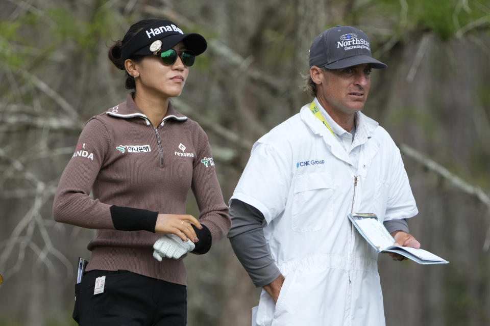 Lydia Ko, of New Zealand, left, prepares to hit from the eighth tee during the second round of the LPGA CME Group Tour Championship golf tournament, Friday, Nov. 18, 2022, at the Tiburón Golf Club in Naples, Fla. (AP Photo/Lynne Sladky)