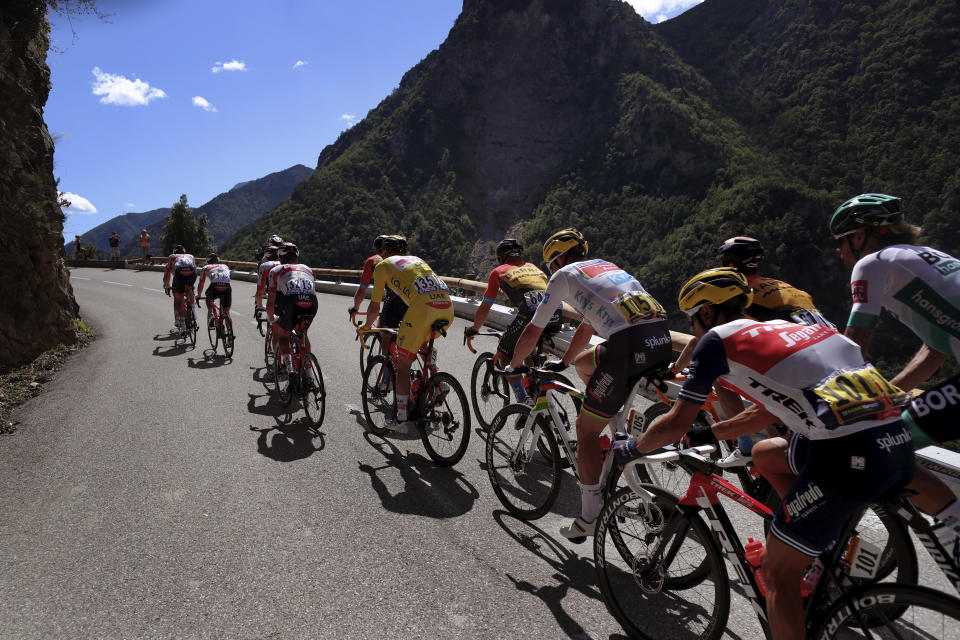 The pack climbs Colmiane pass during the second stage of the Tour de France cycling race over 186 kilometers (115,6 miles) with start and finish in Nice, southern France, Sunday, Aug. 30, 2020. (AP Photo/Thibault Camus)