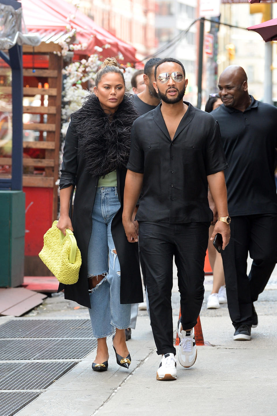 Chrissy Teigen and John Legend walk to a lunch date in New York City. - Credit: Elder Ordonez / SplashNews.com