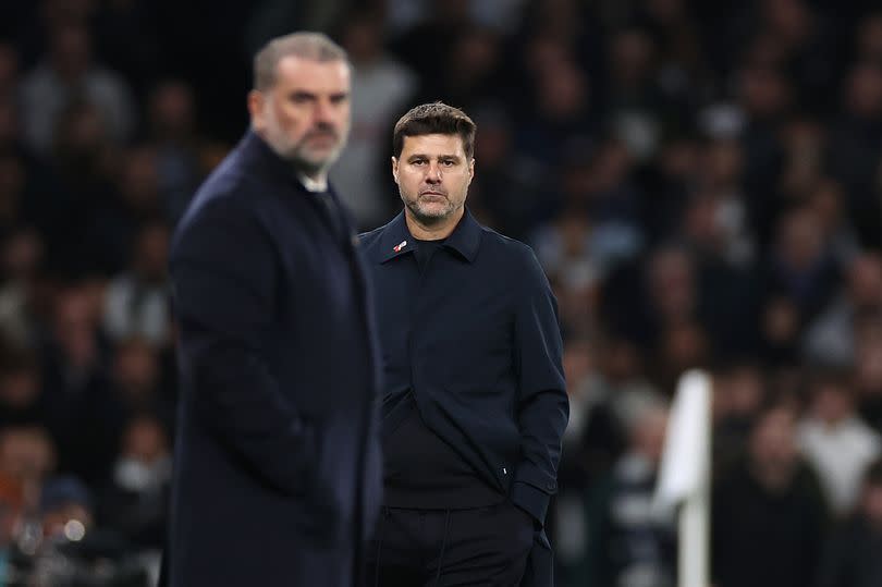 Mauricio Pochettino, Manager of Chelsea reacts as Ange Postecoglou, Manager of Tottenham Hotspur,  looks on in the foreground during the Premier League match between Tottenham Hotspur and Chelsea FC at Tottenham Hotspur Stadium on November 06, 2023 in London, England.