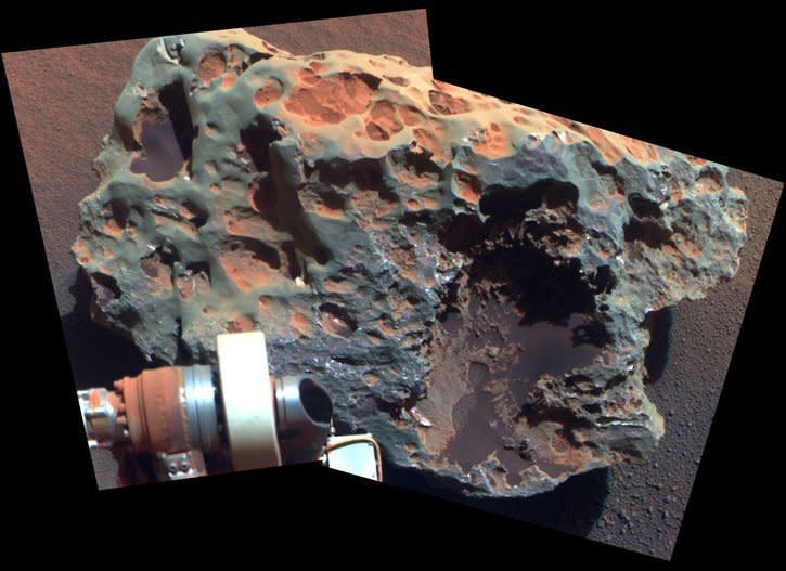 Opportunity occasionally encounters iron and nickel meteorites while driving across the plains of Meridiani.  This Pancam sol 1961 (July 30, 2009) false-color mosaic shows a close up of one called Block Island, which is about 70 cm (28 in) across.    <em>From "Postcards from Mars" by Jim Bell; Photo credit: NASA/JPL/Cornell University</em>    