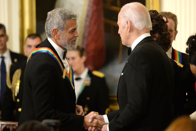 <p>Bonnie Cash/UPI/Bloomberg via Getty Images</p> George Clooney and Joe Biden