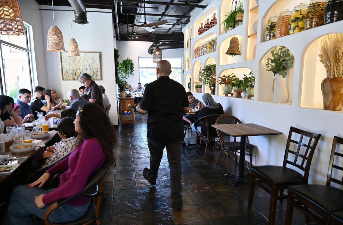 Diners enjoy lunch at Zaatar Bistro, Wednesday, April 10, 2024 in Fresno.