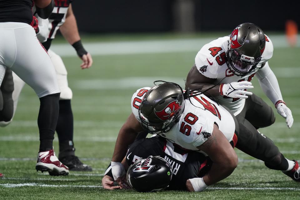 Tampa Bay Buccaneers nose tackle Vita Vea (50) sacks Atlanta Falcons quarterback Matt Ryan (2) during the first half of an NFL football game, Sunday, Dec. 5, 2021, in Atlanta. (AP Photo/Brynn Anderson)