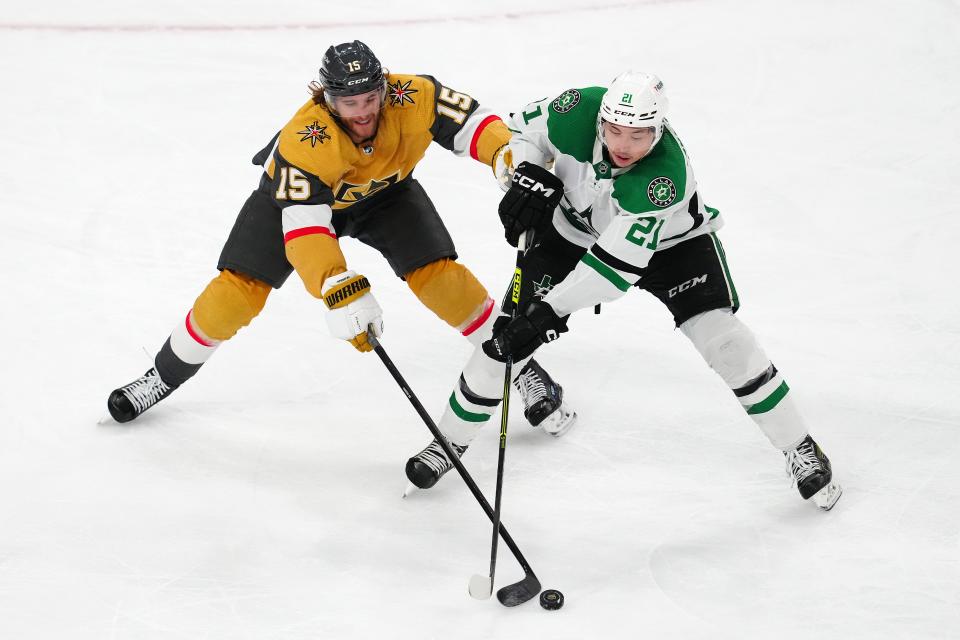 Vegas Golden Knights defenseman Noah Hanifin (15) tips the puck away from Dallas Stars left wing Jason Robertson (21) during Game 6.