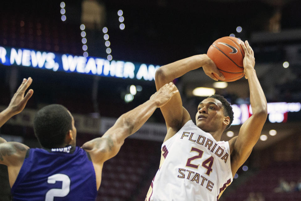 Florida State guard Devin Vassell (24) shoots over North Alabama guard Christian Agnew during a December game. (AP Photo/Mark Wallheiser)