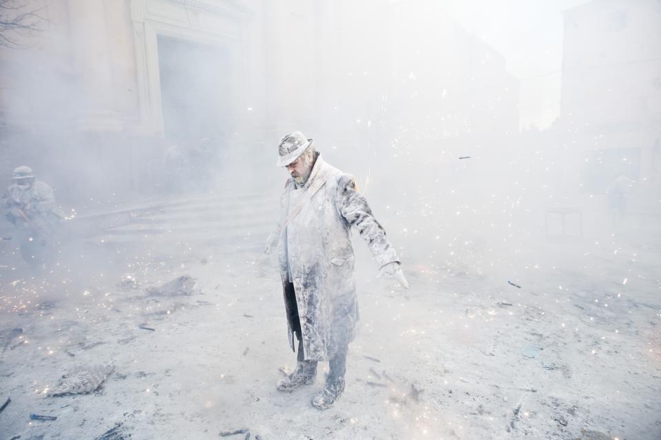 IBI, SPAIN - DECEMBER 28: A Reveller takes part in the battle of 'Enfarinats', a flour fight in celebration of the Els Enfarinats festival on December 28, 2012 in Ibi, Spain. Citizens of Ibi annually celebrate the festival with a battle using flour, eggs and firecrackers. The battle takes place between two groups, a group of married men called 'Els Enfarinats' which take the control of the village for one day pronouncing a whole of ridiculous laws and fining the citizens that infringe them and a group called 'La Oposicio' which try to restore order. At the end of the day the money collected from the fines is donated to charitable causes in the village. The festival has been celebrated since 1981 after the town of Ibi recovered the tradition but the origins remain unknown. (Photo by David Ramos/Getty Images)