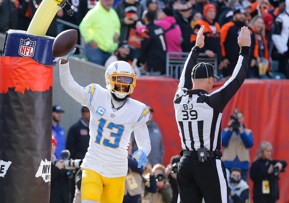 Los Angeles Chargers wide receiver Keenan Allen (13) celebrates the touchdown  catch during the first quarter against the Cincinnati Bengals at Paul Brown Stadium.